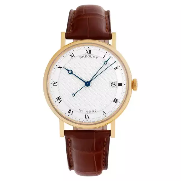 Часы Breguet Classique из 18 каратного золота с серебряным гильошированным циферблатом.
