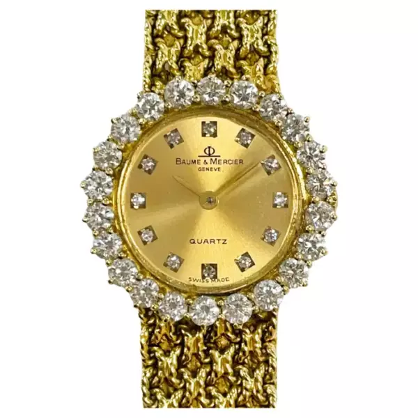 Наручные часы Baume & Mercier из желтого золота с бриллиантами.