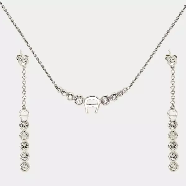 Нежный комплект от Aigner изготовлен из серебра и украшен кристаллами.