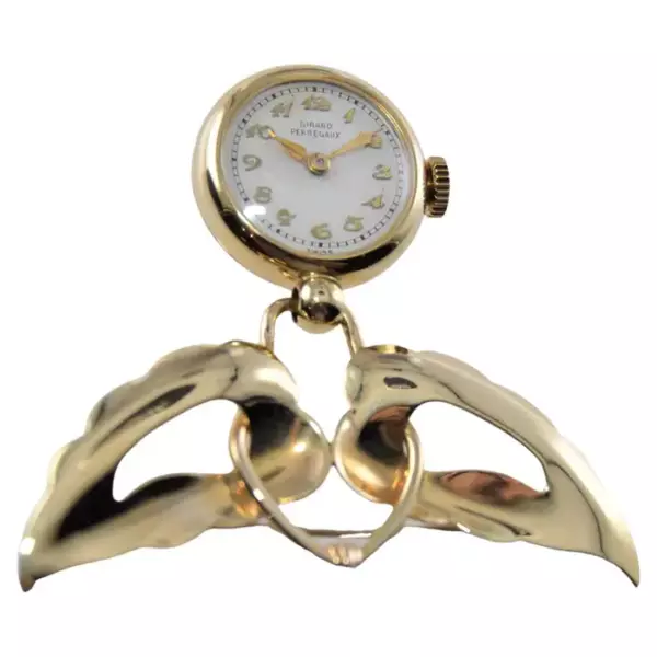 Часы Girard Perregaux из цельного золота в стиле ар деко с лацканами, около 1950 х годов.