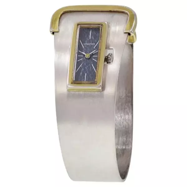 Часы Longines Cuff из стерлингового серебра и позолоченного золота. Часы Longines Cuff из стерлингового серебра и позолоченного золота.