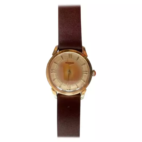 Часы Longines из 14 каратного золота с тропической патиной, Калифорния 1953 г. Часы Longines из 14 каратного золота с тропической патиной, Калифорния 1953 г.