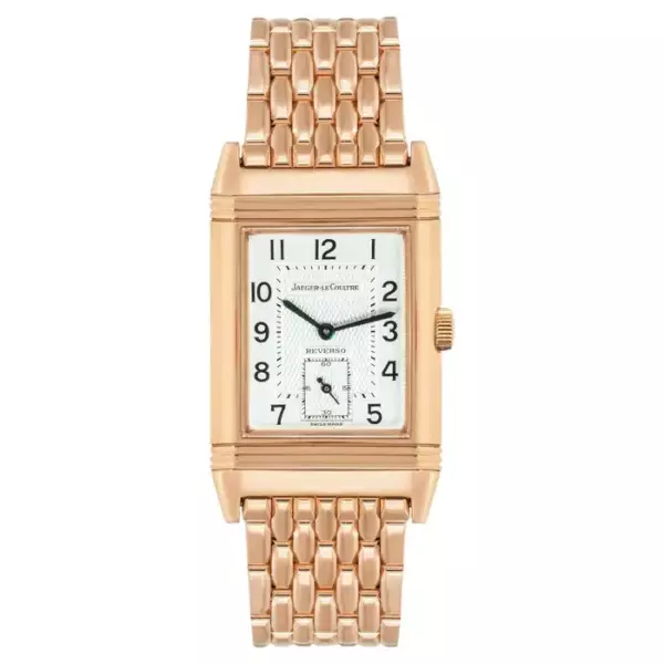 Часы Reverso из розового золота диаметром 26 мм от Jaeger LeCoultre. Имеет серебряный циферблат с арабскими цифрами. Часы Reverso из розового золота диаметром 26 мм от Jaeger LeCoultre. Имеет серебряный циферблат с арабскими цифрами.